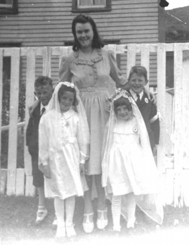 133: Cede McCarthy with four First Communion children. l-r Gordon Carroll, Marie Counsel,  Mary Finn, Kevin Ryan. (circa 1944)  - Gordon son of Michael Carroll &amp;amp; Josie Barry; Marie daughter of Michael Counsel  &amp;amp; Mary Anne Barry; Mary daughter of Patrick Finn &amp;amp; Lena Hayward; Kevin son of  Albert Ryan &amp;amp; Catherine Nolan